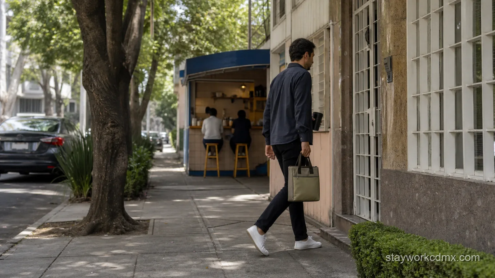 A remote worker walks from a simple Narvarte lunch stop toward a residential apartment during an ordinary weekday.
