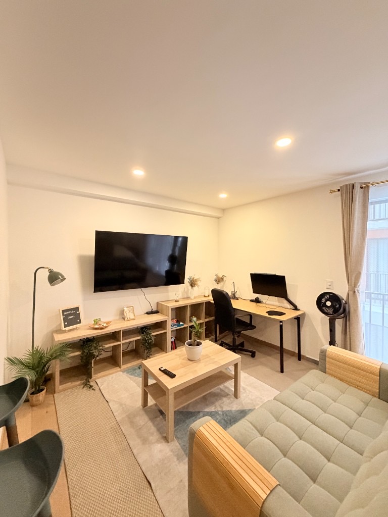 Bright Roma Norte loft sofa beside balcony doors