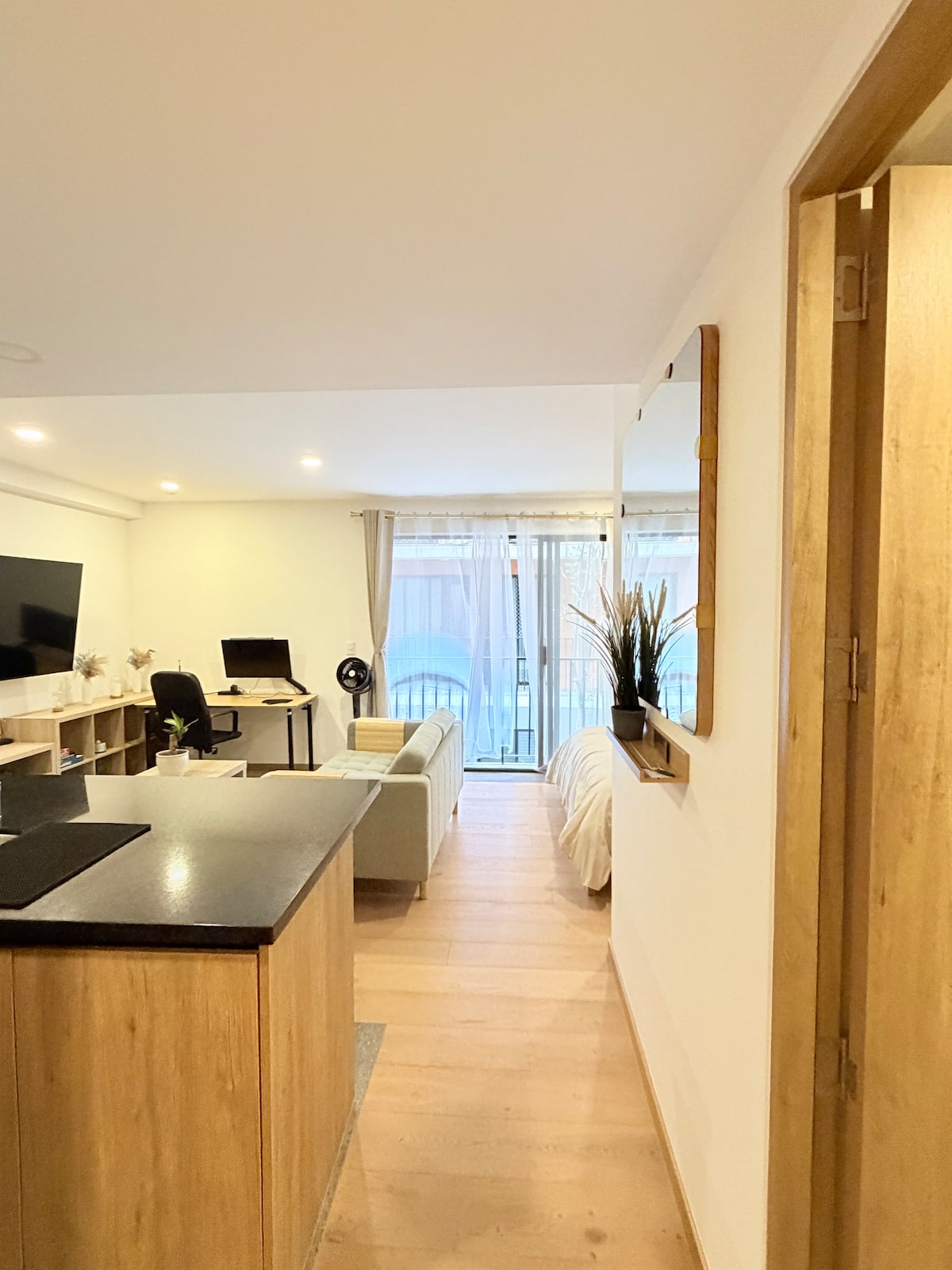 Remote-work Roma Norte loft living area facing the balcony
